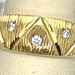  14K YELLOW GOLD BAND WITH INTRICATE DESIGNS ACCENTED BY DIAMONDS SIZE 10