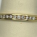 14K YELLOW GOLD BAND WITH CHANNEL SET DIAMONDS SIZE 11.5