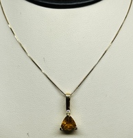  14K YELLOW GOLD NECKLACE WITH TRIANGLE ORANGE STONE AND A DIAMOND