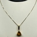  14K YELLOW GOLD NECKLACE WITH TRIANGLE ORANGE STONE AND A DIAMOND